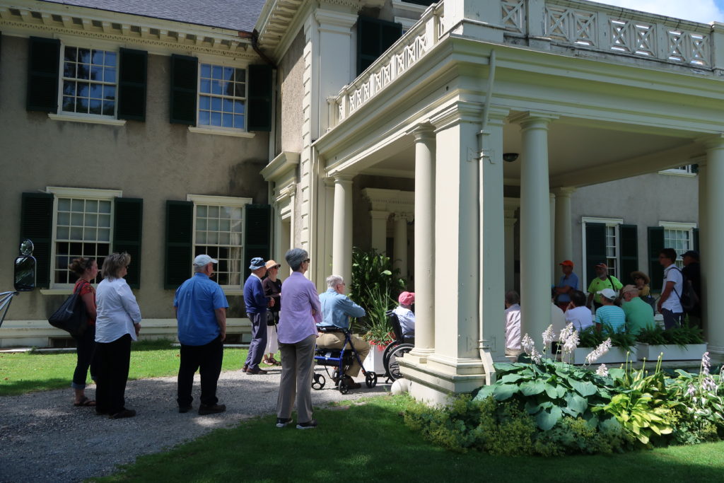 Group gathers outside historic house